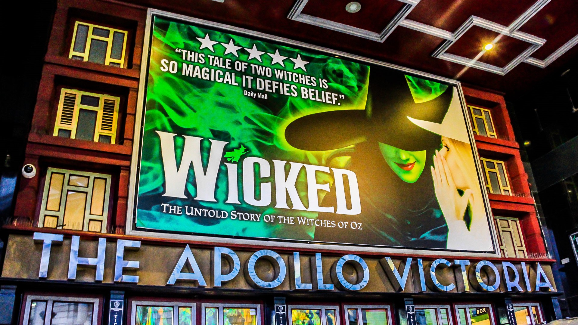 The Apollo Victoria Theatre displaying signage for the show Wicked.